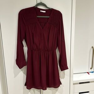 Wonderful burgundy dress (colour of the season!) lined with pockets.